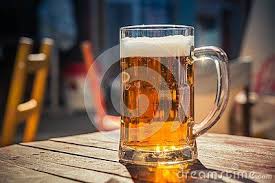 Close Up On A Glass Of Beer Casting A Shadow On A Wood Table And Space For Text On The Left Beer Wood Beer Beer Glass