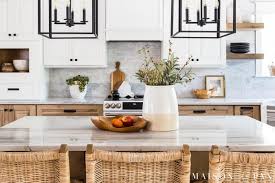 White brightens a kitchen, which can help with tasks like chopping, and promotes a light and airy atmosphere that's welcoming to family and guests. White And Wood Kitchen Reveal Part 1 Cabinets Maison De Pax