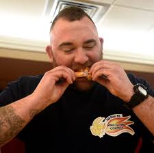 Chowing down for a good cause at wing-eating contest
