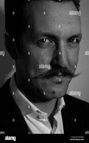 In this photo taken June 15, 2009, hog farmer Dave Struthers holds a pig