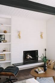Continue placing mortar and bricks in this fashion until all the walls are covered. Mid Century Modern Living Room White Painted Brick Shiplap Exposed Mid Century Modern Living Room Mid Century Modern Interiors Modern Interior Design