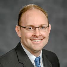 PERI faculty members (from left) Steven Sprick Schuster, Daniel Smith, and  Ennio Piano celebrate PERI Fellow Protik Nandy's suc