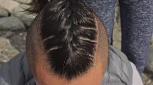 That's viking hairstyles which are synonymous with traditional. Mans Hair From Pigtails Woman Braids The Hair Of A Man Boy Does A Viking Hairstyle Weave Hair Near A Mountain River Video By C Ivandan Stock Footage 223519258