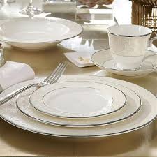 The delicate floral pattern of burnished gold with pierced detailing is uniquely lenox and creates a romantic, vintage vibe that still feels fresh. Lenox Opal Innocence 5 Piece Place Setting Kathy Kuo Home