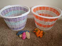 Each player must throw from behind the front of the box. Easter Bean Bag Toss Game Made From Laundry Baskets One Set Are Eggs And The Other Set Are Carrots Bean Bag Toss Bag Toss Game Bean Bag Toss Game