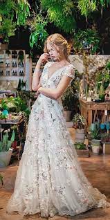 Wedding dress with colourful flowers. Floral Wedding Dresses For Brides That Are Pretty Colored Wedding Dresses Wedding Dresses Floral Wedding Dress