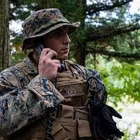US Navy 031018-N-4055P-011 Lance Cpl. Leighton Becker talks with teammates  over the radio
