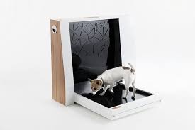 We keep our litter box in the laundry room and previously had a latch on the door that let the cat in but kept the dog out. Automated Pet Toilet Is Like A Litter Box For Dogs Simplemost