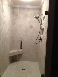 Porcelain tile shower in a complete bath remodel. Bathroom Renovation Tile Shower Ivetta White Glazed Porcelain Tile Tile Bathroom White Bathroom Tiles Bathroom Redesign