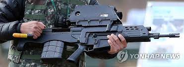 It consists of two separate weapons combined into a single unit: K11 Rifle Program Suspension Yonhap News Agency