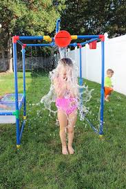Pvc water sprinkler for kids. 7 Crazy Lawn Sprinklers That Will Get Your Kids Outside All Summer Long Cool Mom Picks Backyard Toys Backyard Water Parks Backyard For Kids