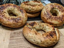 Once the onion bagel is finished, take it out, sprinkle some cheese on the inside parts and put into the microwave to melt it. Garlic Onion Bagels Boxcar Cook