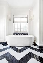 Go all over with dark tiles. Marble Chevron Bathroom Floors Design Ideas