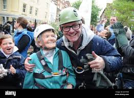 96 YEAR OLD DORIS LONG AND CHRIS EVANS AFTER ABSEILING 200 FEET DOWN THE  SIDE OF MILLGATE HOUSE IN PORTSMOUTH. PIC MIKE WALKER 2013 Stock Photo