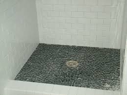 White Subway Tile Shower With Pebble Floor