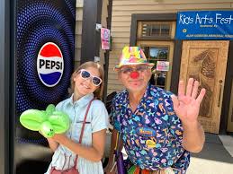 Arts festival and car show draw big holiday-weekend crowds