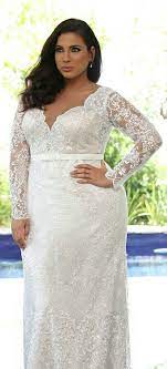 Plu Size Fitted Bridal Gown Made Of A Gentle Romantic Lace With Long Sleeves And A Simple Plain Belt Plus Size Wedding Gowns Wedding Dresses Plus Size Wedding