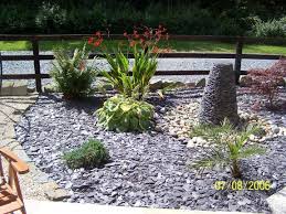 Slate Chips In Flower Bed Google Search Slate Garden Raised Garden Designs Flower Garden Design