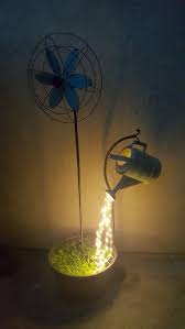 These can make for unique centrepieces and sources of low light. Watering Can With Fairy Lights Click Here Https Amzn To 2jcnnry Lifestyle S Backyard Ideas For Small Yards Backyard Lighting Small Backyard Landscaping