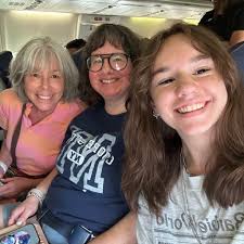 How do four girls optimize bathroom sharing and cleaning responsibilities  in a dorm room?