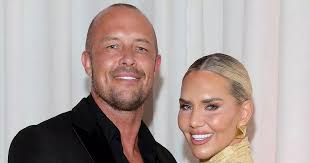 Erin McGregor steps out in chic sheer dress as husband Terry takes to the  stage at swanky event