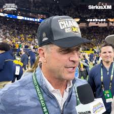 Jim Harbaugh is now a National Champion., His brother John won Super Bowl  XLVII. His father Jack won the 2002 1-AA National Championship., After the  game Ravens Head Coach John Harbaugh spoke about ...