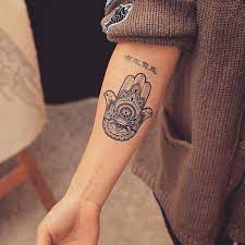 The eye could be either a religious symbol or it could mean that the owner wants to look after the people that. 245 Spiritual Hamsa Tattoo Designs 2021 Hand With Eye Ideas