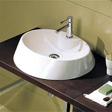 There is a decent amount of confusion when it comes to the differences between vitreous china and porcelain. Nameeks Scarabeo Rugby 33 80 In X 17 70 In White Vitreous China Oval Washbasin Self Rimming Bathroom Sink Rona