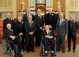 Jubilarians, from left, Fr. Paul Reich (seated), Fr. Marti…
