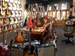 Dusty Stings Acoustic Music Shop S Collection Of Electric Guitars Music Store Interior Store Layout Music Shop