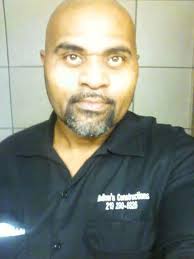 The Jackson Posing In Front of the Marquee at the Palace Theater saying  featuring the Jacksons.