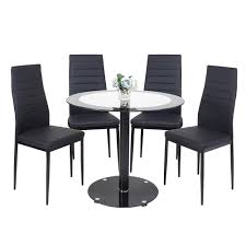 We have a unique collection of tables in a variety of. Round Dining Table And Chairs Tempered Glass Round Pedestal Table And 4 Faux Leather Padded Chairs Kitchen Black Dining Table Set Buy Online In Macedonia At Macedonia Desertcart Com Productid 142229810
