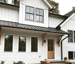 To keep the space from feeling too austere, you might add in colorful accents, like a blue or red rug. Black Windows Match Exterior Accents On Modern Farmhouse Pella