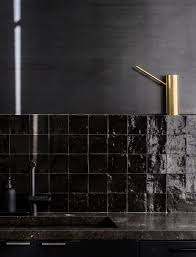 Black And Gold Kitchen Tiles Kitchen Of The Week A Study In Black By Designer Nicole Hollis Remodelista Black Tiles Kitchen Kitchen Tiles Backsplash Kitchen Tiles Design