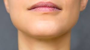 Caucasian woman makes sure that her african boyfriend is sleeping and taking smartphone in hands. 7 Surprising Facts About The Chin Mental Floss