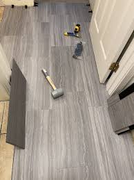 Expert advice on how to install laminate under a by installing the flooring first, you will also be able to more easily switch up cabinetry or fixtures, without having hi, i just purchased lifeproof from home depot for my master bathroom. Luxury Vinyl Plank Pros And Cons Bathroom Edition Penny Modern