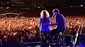 James introduces Bonnie Raitt at Fenway Park | Facebook