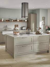 Here, back of the island, combines circles, curves similar. Fairford Sage Green Kitchen Fitted Kitchens Howdens
