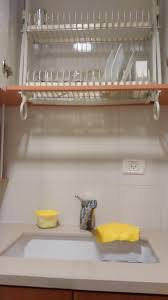 It will look similar to some kitchens that have higher cabinets above their cooktop. This Bottomless Cupboard Above The Sink Lets You Put Your Washing Away Wet Mildlyinteresting