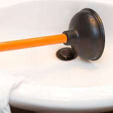 how to clear sink drains with a plunger