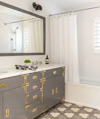 It is made in brass and white lacquered wood and features a portuguese pink marble top. Gray Campaign Vanity With Brass Hardware And Gray Mirror Contemporary Bathroom
