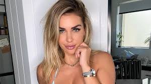 Shelby Bilby flaunts her figure in a tiny yellow two-piece by the pool