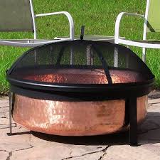Round steel wood burning outdoor deep fire pit in copper/black finish with grilling grate by pure garden has a chic copper colored bowl that is attractive to match any outdoor living space decor. Our Best Outdoor Decor Deals Copper Fire Pit Fire Pit Screen Fire Pit Backyard