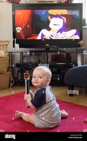 Baby With Remote Control Tv Remote Tv Watch Child Changing Baby Movie Calm Boy Power Music Calmness Television Sit Stock Photo Alamy