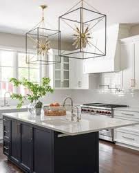 The bronze metalwork coupled with distressed wood crisscorss are the perfect compliment to the beige linen shades. 190 Island Lighting Ideas In 2021 Kitchen Design Kitchen Remodel Kitchen Inspirations