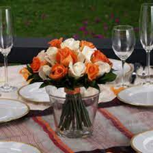 Wholesale flowers online for diy weddings and bulk flowers for special events. Orange Wedding Centerpiece Orange White Roses Centerpieces Globalrose