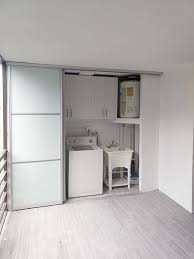 sliding doors for laundry unit glass and aluminum design doors spacious laundry with washing drying machin closet doors sliding cabinet doors cabinet doors