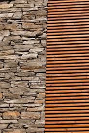 Wall Finishing Material Ideas Featured Stone Wall And Wood Array Finishing Wall Material Wood Designs On Walls Decorations Interior Wooden Wall Finishing Materi