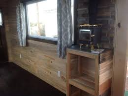 Blue pine also known as beetle kill pine is the result of the bark beetle carrying a fungus in the tree that ultimately changes its color and kills the tree. 196 Square Foot Tiny Home Built With Beetle Kill Pine For Sale Tiny Houses