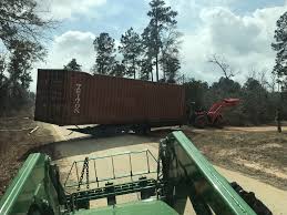 In the container yards and depots, container forklifts are the most common way to move them around, like pictured above. Moving Shipping Containers Tractorbynet